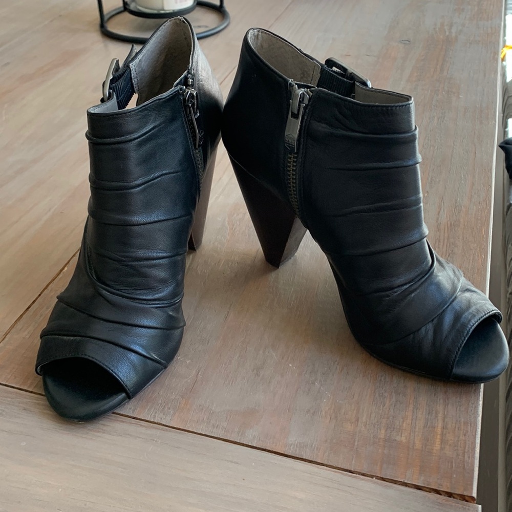 Vince camuto heeled open toed booties.